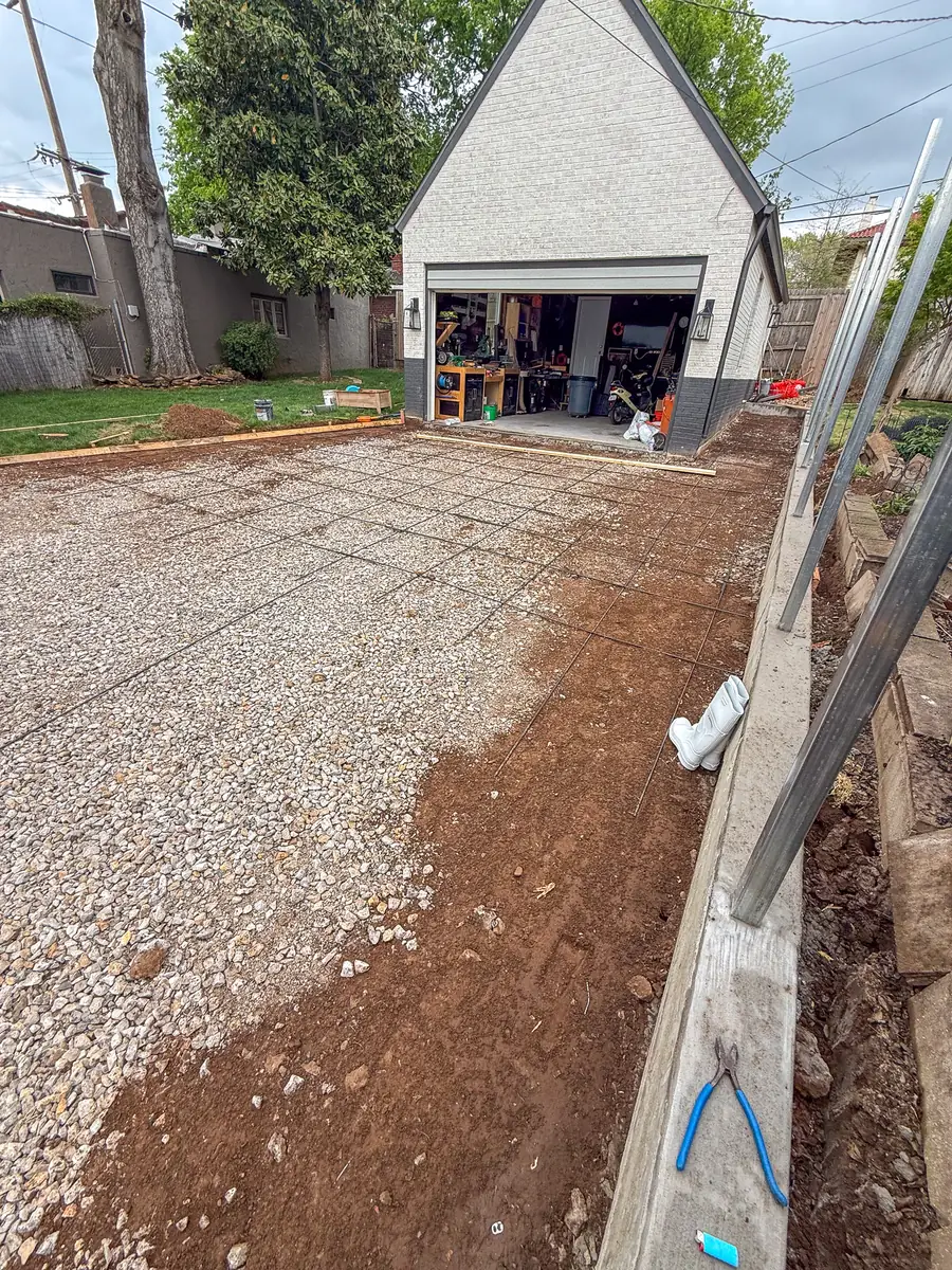 Gravel base and rebar set for a driveway to a detached garage