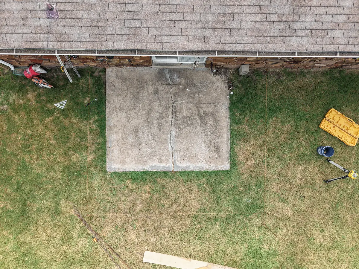 Top-down view of an old concrete patio slab before tear-out