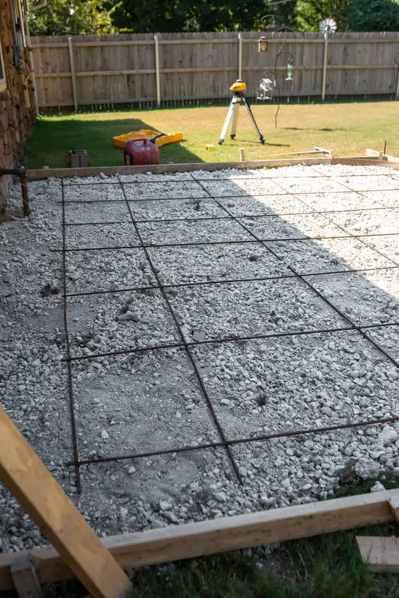 Rebar grid over gravel base inside patio forms