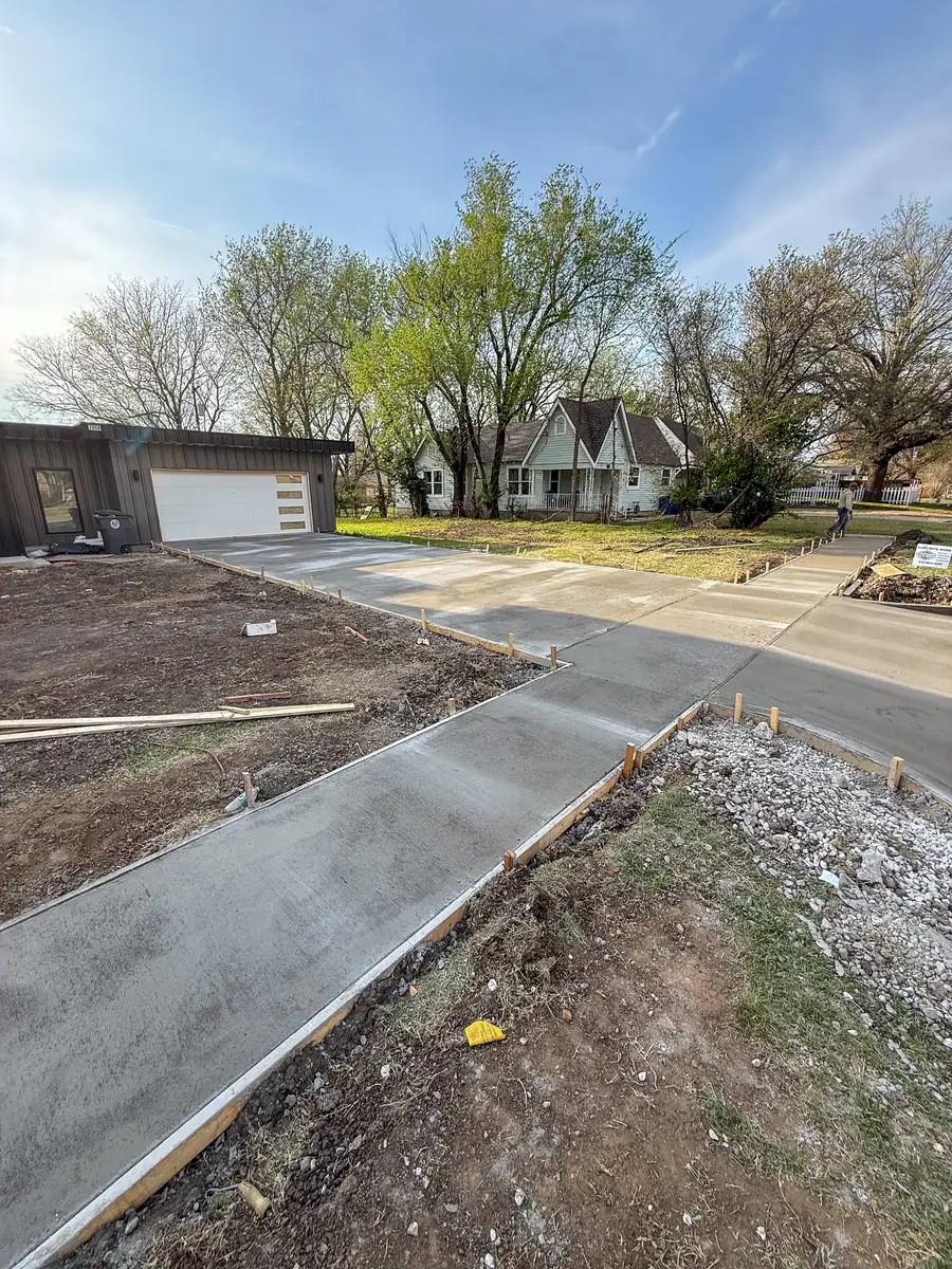 New concrete sidewalk and driveway at a modern home
